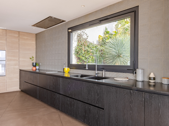 Modern kitchen with views of nature, architect-designed house Roucas Blanc in Marseille.