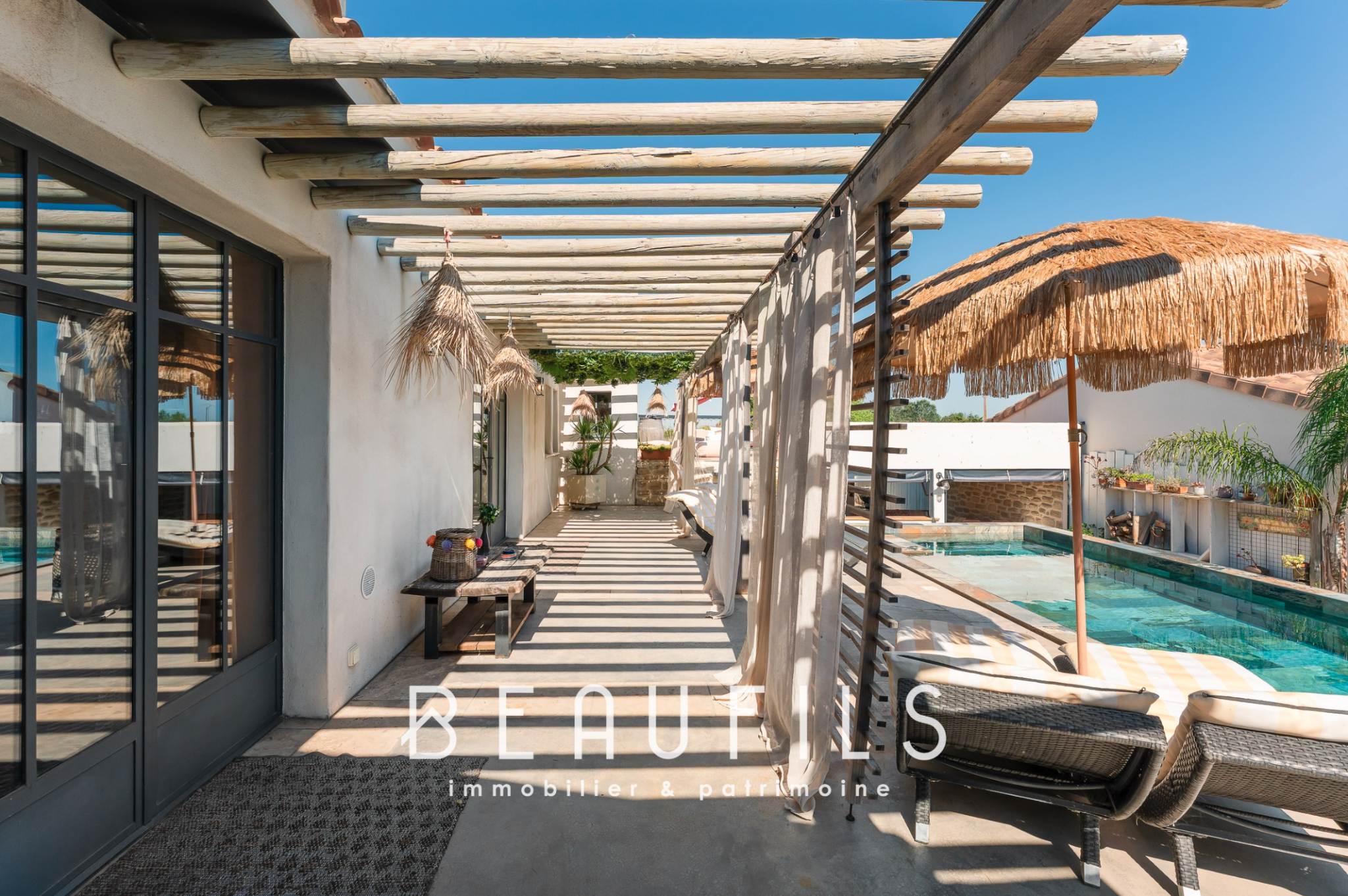 Mediterranean villa in Saintes Maries de la Mer Terrace of a Mediterranean villa with swimming pool and parasols in Saintes Maries de la Mer.