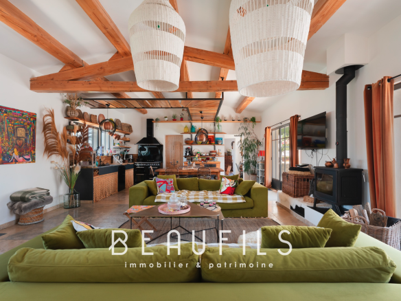 Interior of a Mediterranean villa with a spacious living room and bohemian decorative elements.