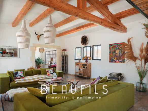 Interior of a Mediterranean villa with a spacious living room and bohemian chic decorative elements.
