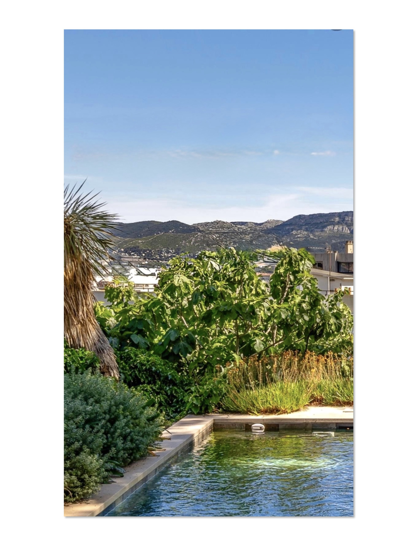 House with swimming pool in Marseille View of pool and garden with mountains in the background in Marseille.