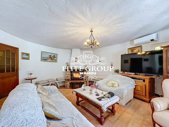 Interior of a Provençal villa in Mougins, living room with sofa and television.
