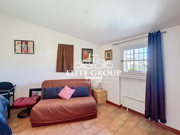Interior of a Provençal villa in Mougins with a sofa and wall decorations.