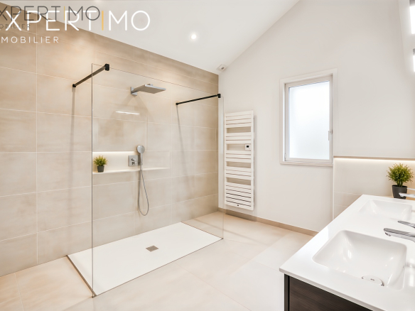 Modern bathroom with walk-in shower and sink in Relecq-Kerhuon.