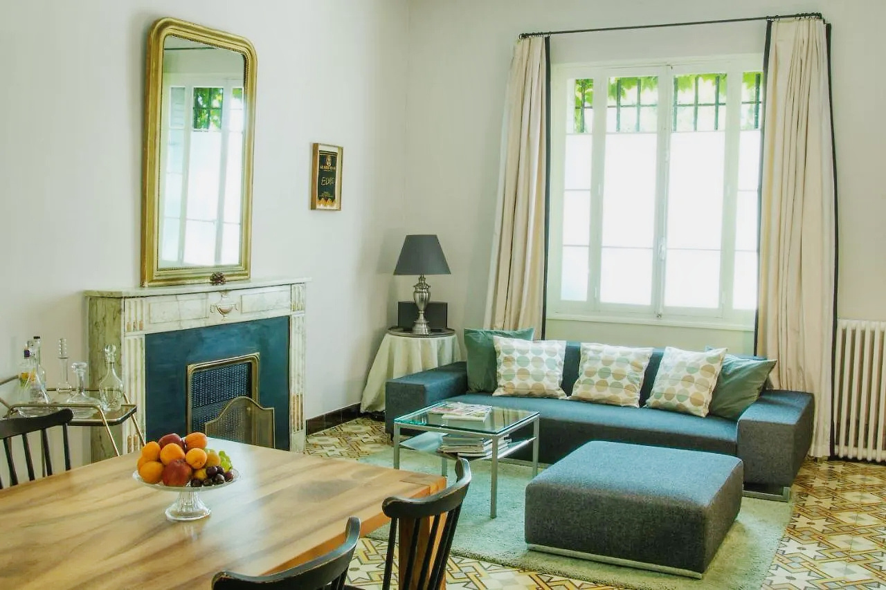 Interior of a renovated bastide with a living room and dining room, L'Isle-sur-la-Sorgue.