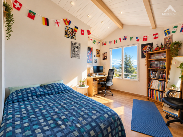 Chambre lumineuse avec vue sur le Mont-Blanc, décorée de drapeaux et d'affiches.