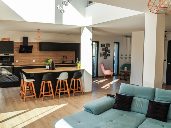 Interior of a contemporary villa with open kitchen and bright living room in Narbonne.
