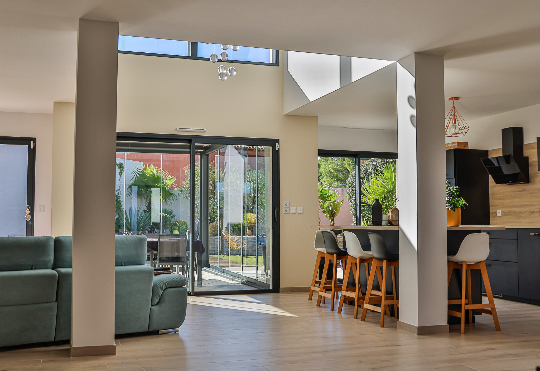 Interior of a contemporary villa in Narbonne Interior of a contemporary villa with a bright living room, modern kitchen and access to the terrace.