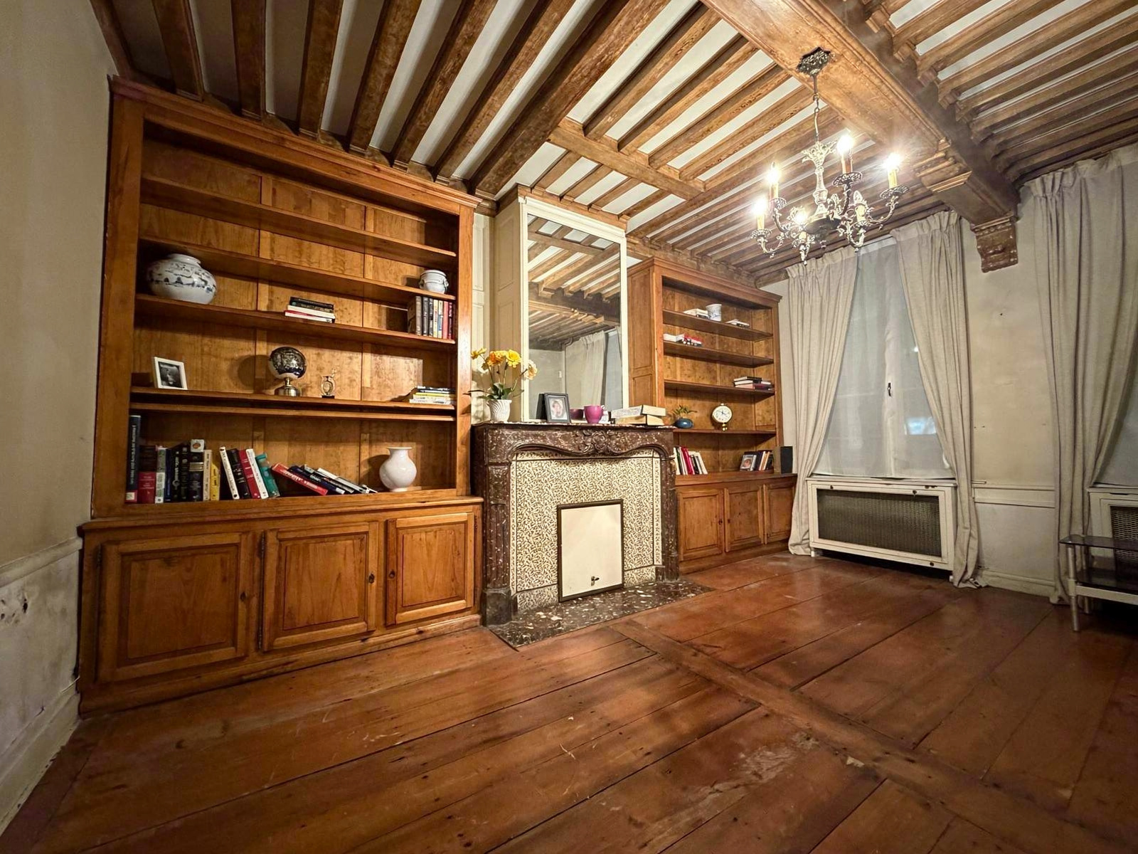 Interior of a mansion in Lille Interior of a mansion in Lille with wooden shelves and antique parquet flooring.