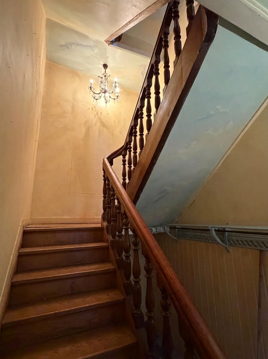 Staircase of a mansion in Lille Wooden staircase leading to the upper floor of a mansion in old Lille.