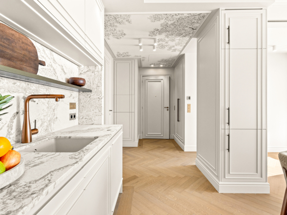 Modern kitchen with marble worktop and natural lighting