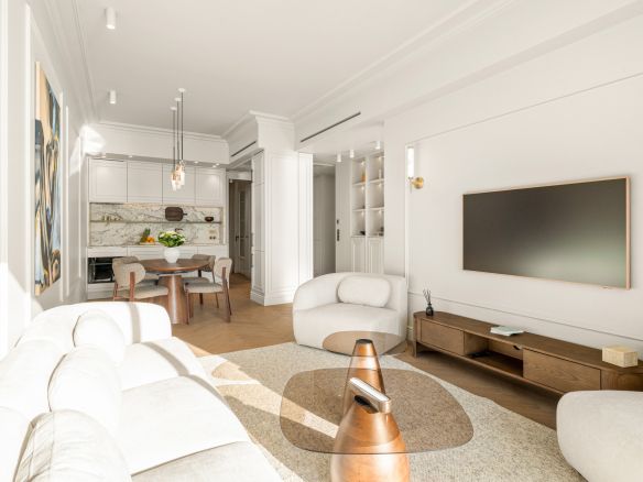 Bright living room of a renovated apartment with sea view in Nice, modern furniture and elegant decoration.