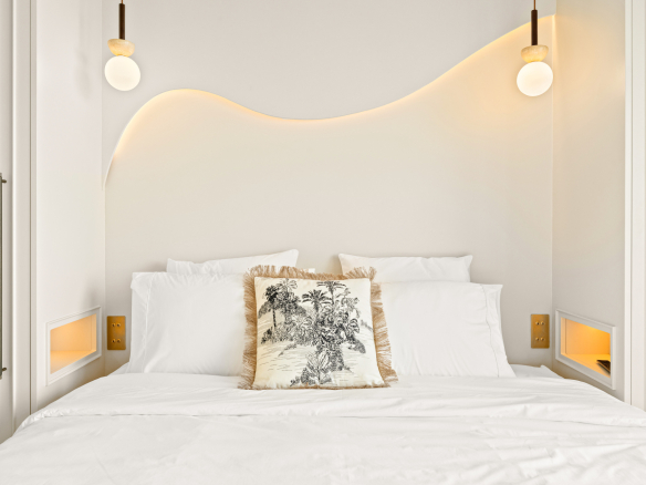 Room in a renovated apartment with a double bed and modern decor.