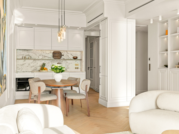 Interior of a renovated apartment with sea views in Nice, including a living room and a modern kitchen.
