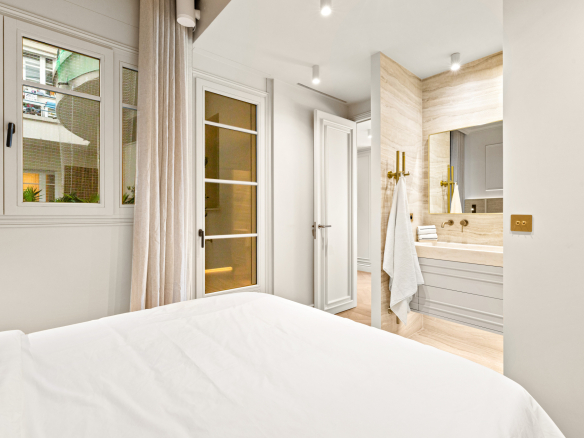Interior of a renovated apartment with sea views in Nice, including one bedroom and one bathroom.