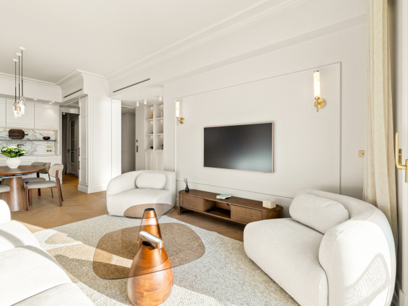 Bright living room of a renovated apartment with sea view in Nice, modern furniture and elegant decoration.