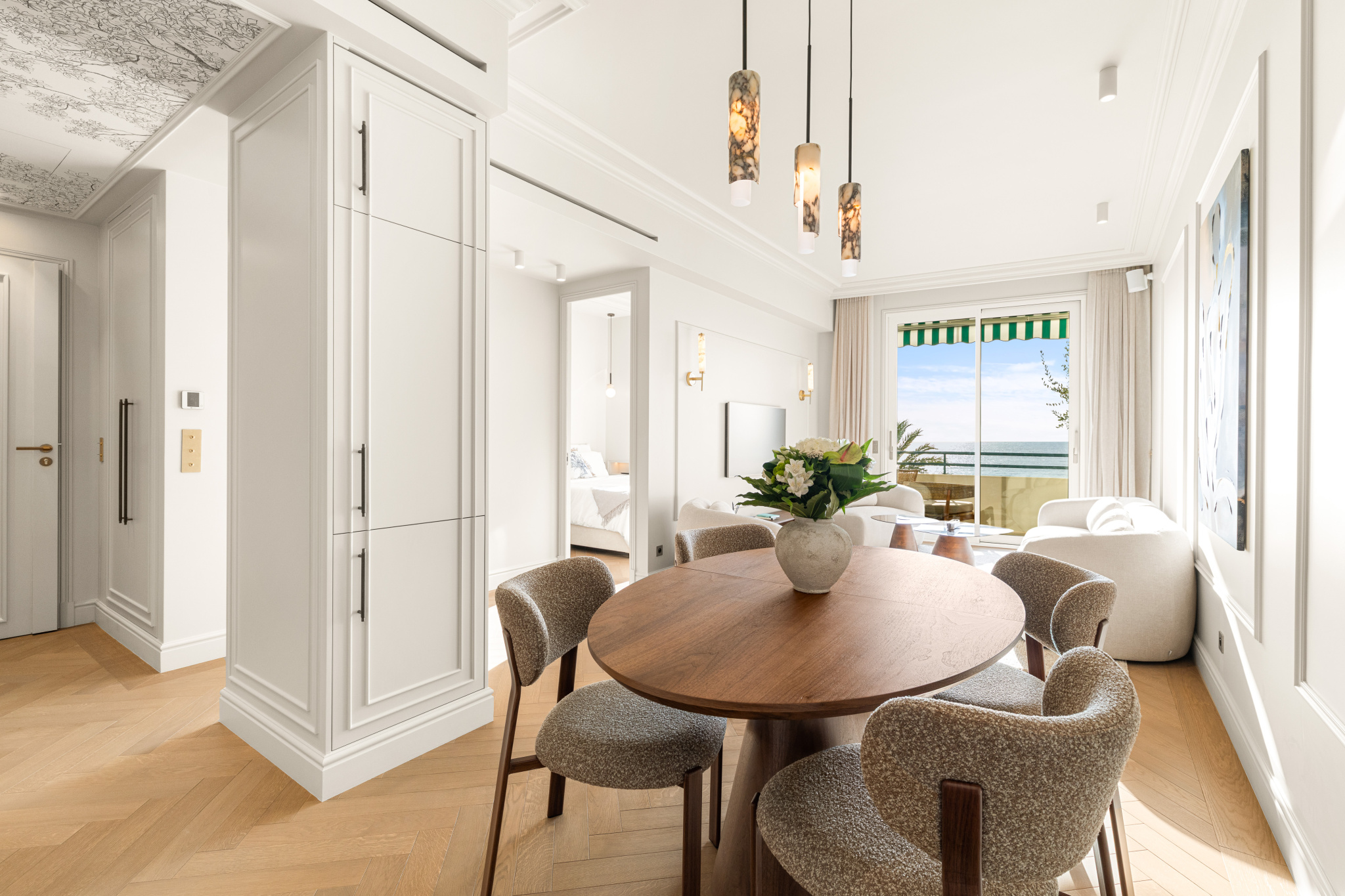 Renovated apartment with sea view in Nice Interior of a renovated apartment with sea view in Nice, round table and modern decor.