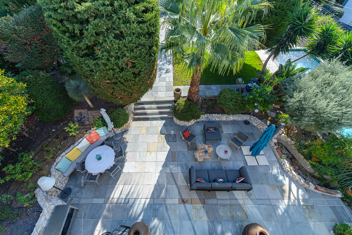 Aerial view of a garden with swimming pool and outdoor furniture, Marseille.