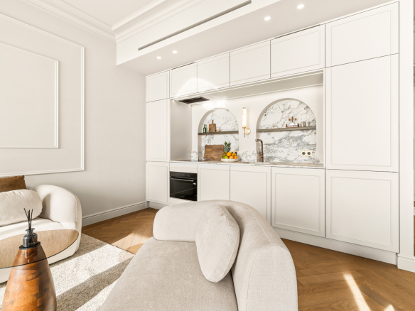 Intérieur d'un appartement rénové avec cuisine moderne et salon confortable à Nice.