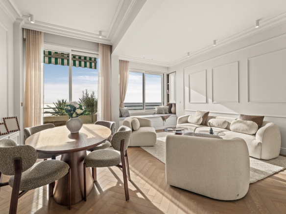 Interior of a renovated apartment with sea view in Nice, modern and bright furniture.