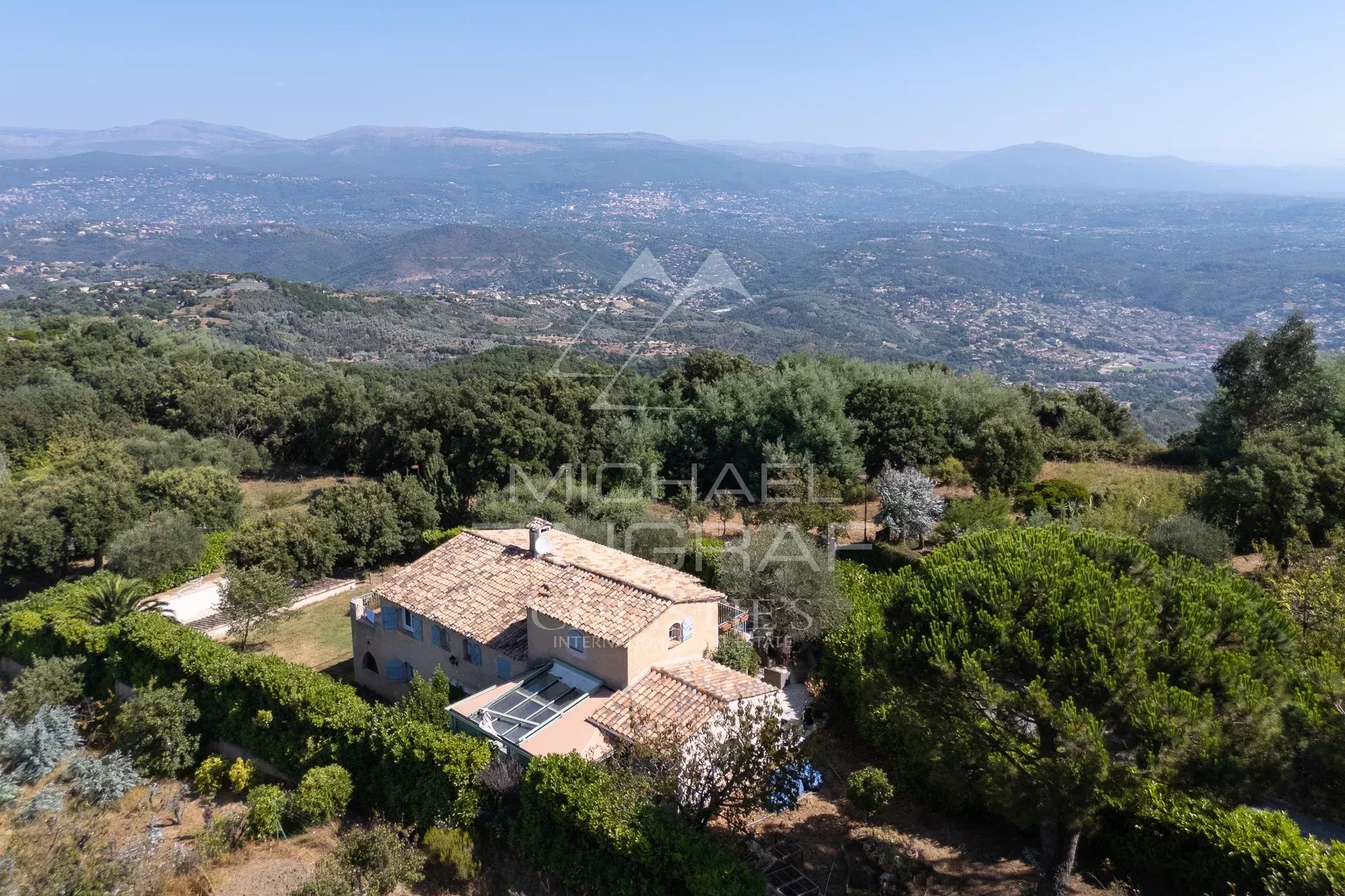 Aerial view of a property with swimming pool and landscaped grounds in Mandelieu-la-Napoule.