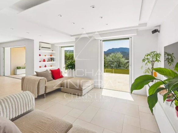 Interior of a contemporary villa with views of nature, bright and modern living room.