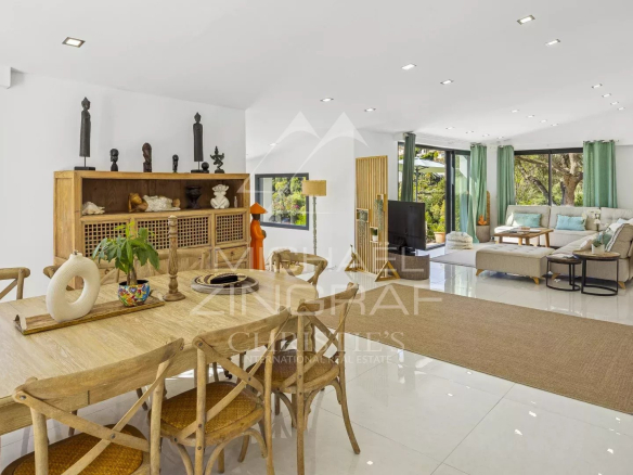 Interior of a renovated modern villa with bright living space and contemporary furniture.