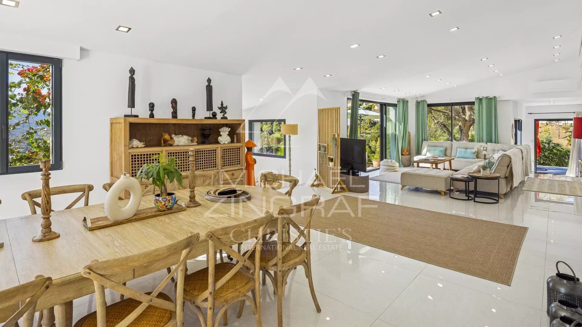 Interior of a renovated modern villa with bright living space and contemporary furniture.