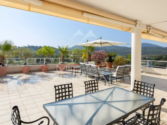Spacious terrace of a top floor apartment overlooking the Barbossi golf course in Mandelieu-la-Napoule.