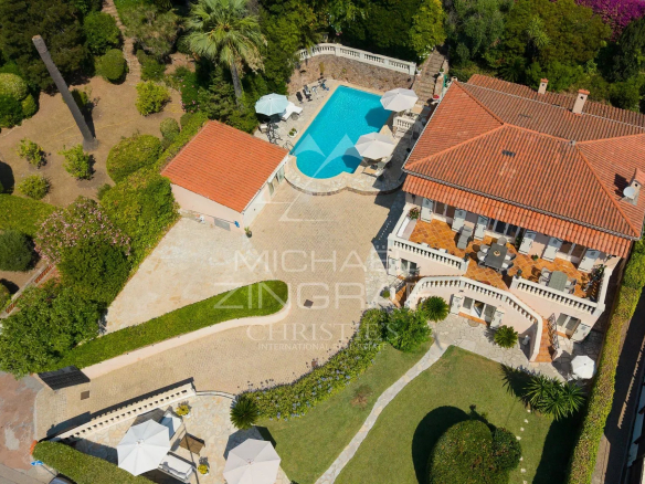 Aerial view of a family villa with swimming pool and garden in Théoule-sur-Mer.