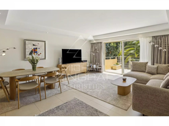 Interior of a contemporary apartment with living room, dining room and access to a balcony.