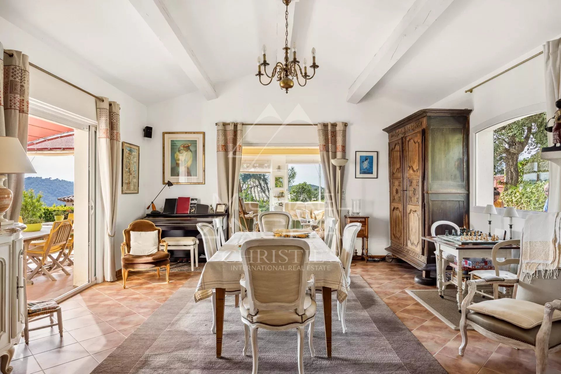 Interior of a Provençal villa Interior of a Provençal villa with living room, dining room and piano, overlooking the garden.