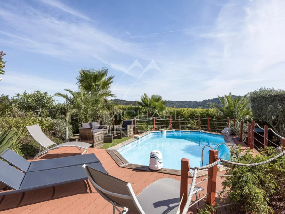 View of a Provençal villa with salt water pool and garden in Tanneron, near Mandelieu-la-Napoule.