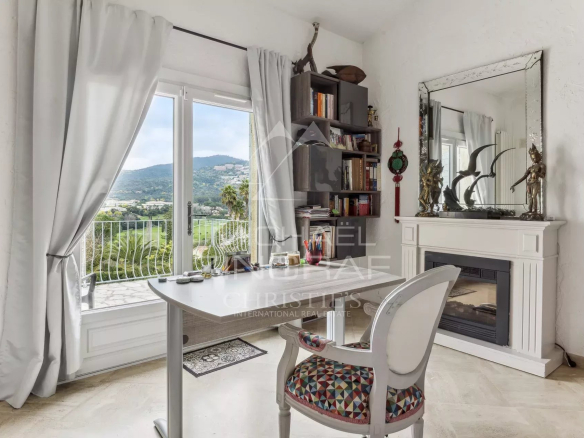 Interior of a family home in Mandelieu-La Napoule with views of the mountains and golf course.