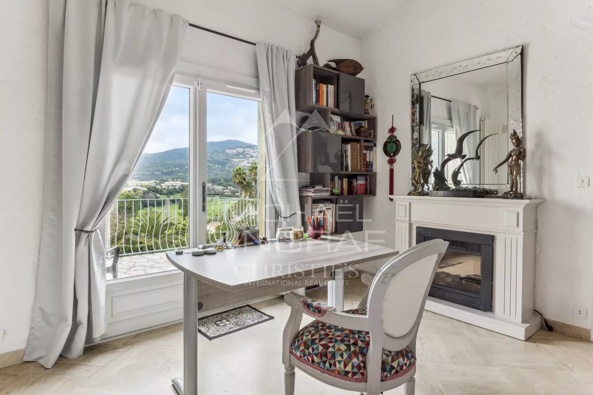 Interior of a family home in Mandelieu-La Napoule with views of the mountains and golf course.