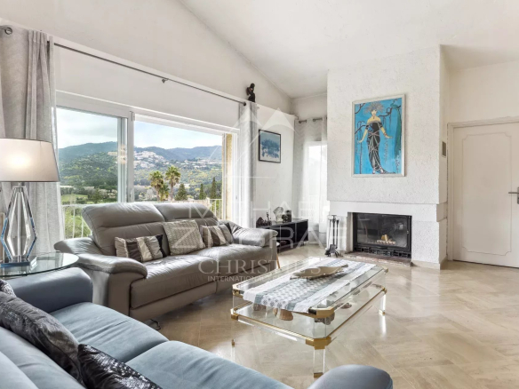 Interior of an elegant family home in Mandelieu-La Napoule with views of the mountains and golf course.