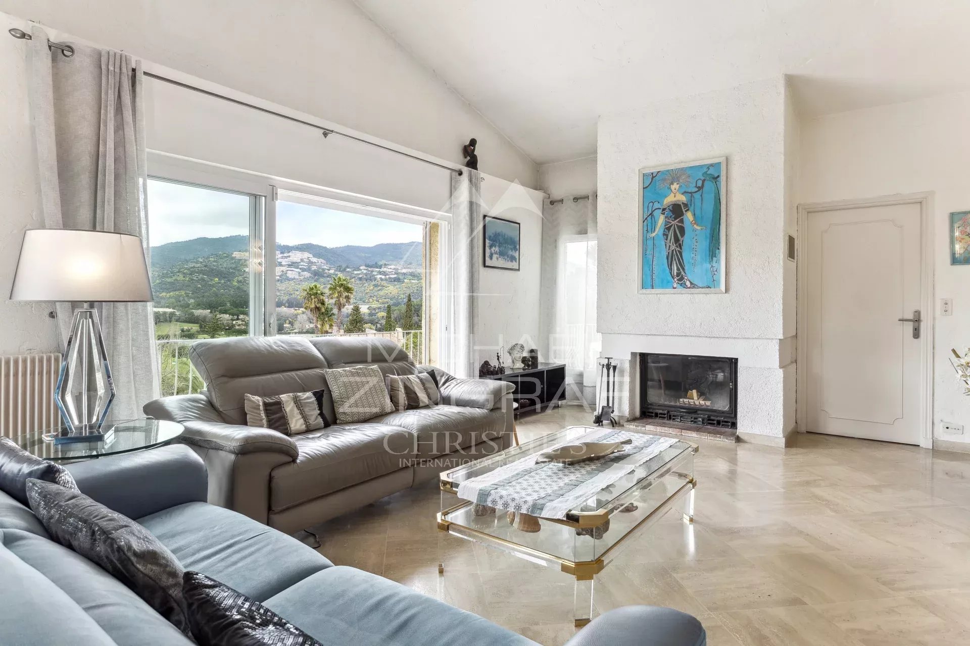 Interior of an elegant family home in Mandelieu-La Napoule with views of the mountains and golf course.