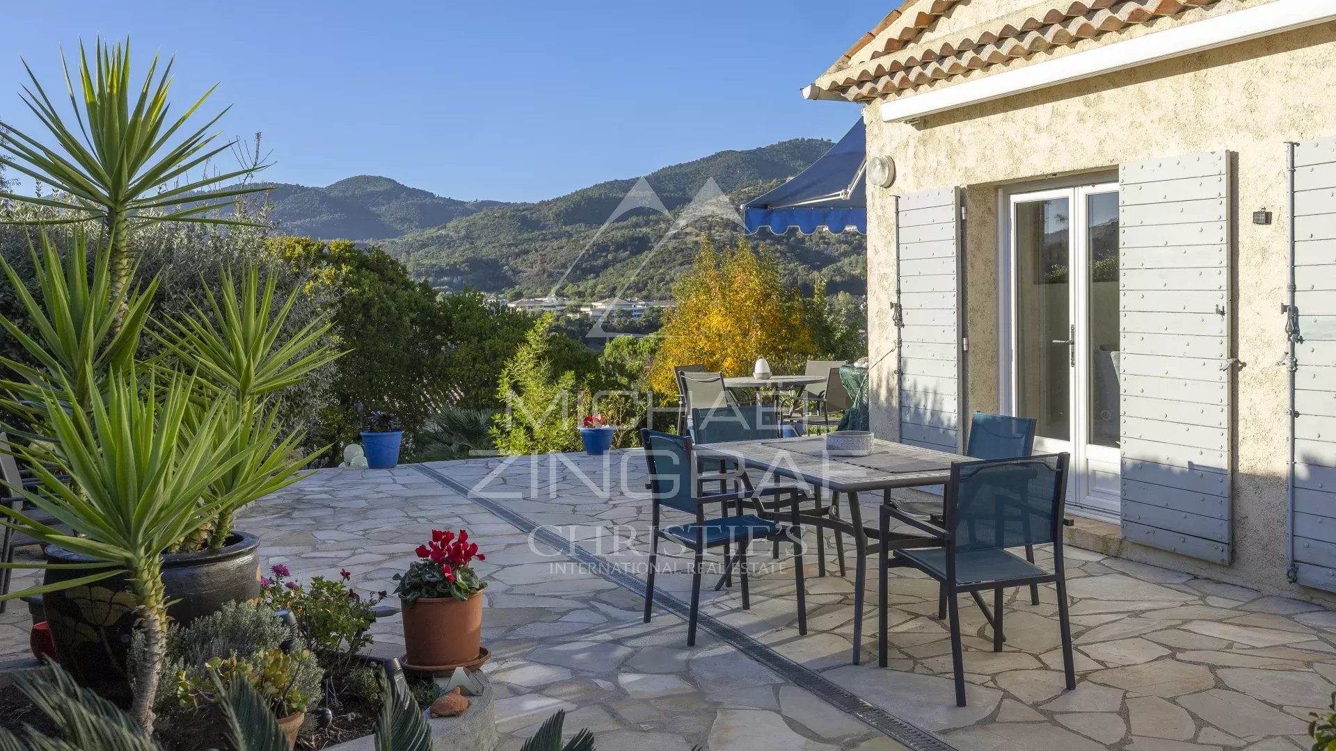 Terrace of a family home in Mandelieu-La Napoule with views of the mountains and golf course.