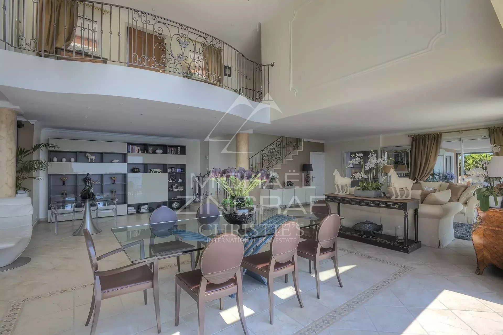 Interior of a villa in Anthéor Interior of a spacious villa with dining room and living room, sea view.