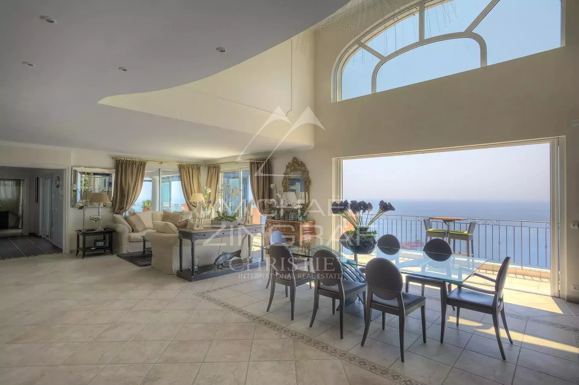 Villa with sea view in Anthéor Interior of a villa with sea view, spacious living room and dining room.