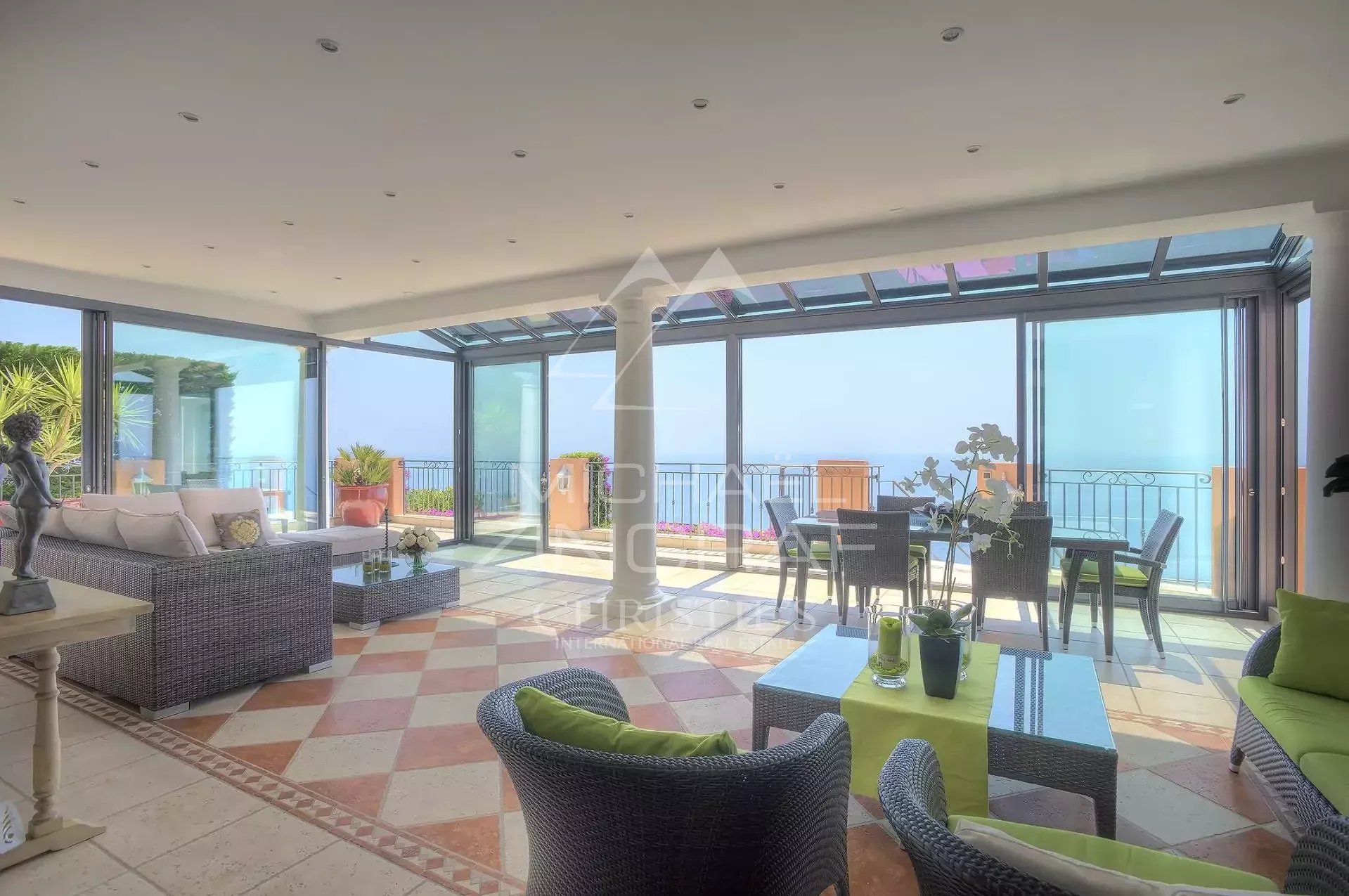 Villa interior with sea view Interior of a villa with sea view, bright living room and modern furniture.