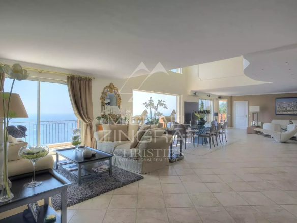 Interior of a spacious villa overlooking the Mediterranean Sea, bright living room and elegant decor.