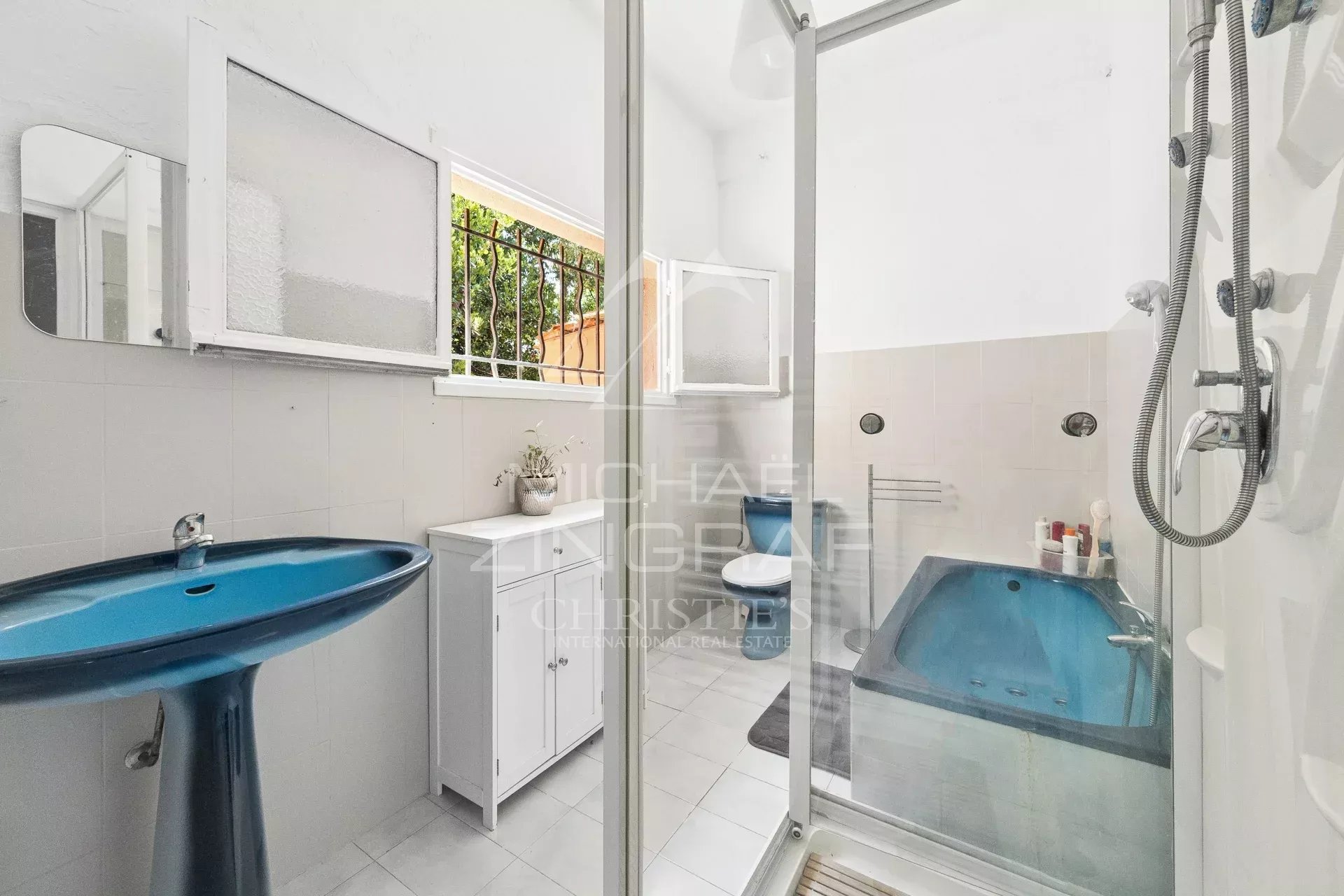 Renovated bathroom Bathroom with shower and bathtub, light tiles and modern features.