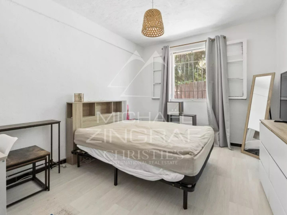 Room in a villa to be renovated with bed, desk and window, Mandelieu-la-Napoule.