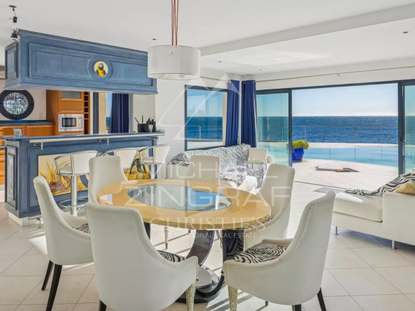 Interior of a modern villa with sea view, bright living and dining room.