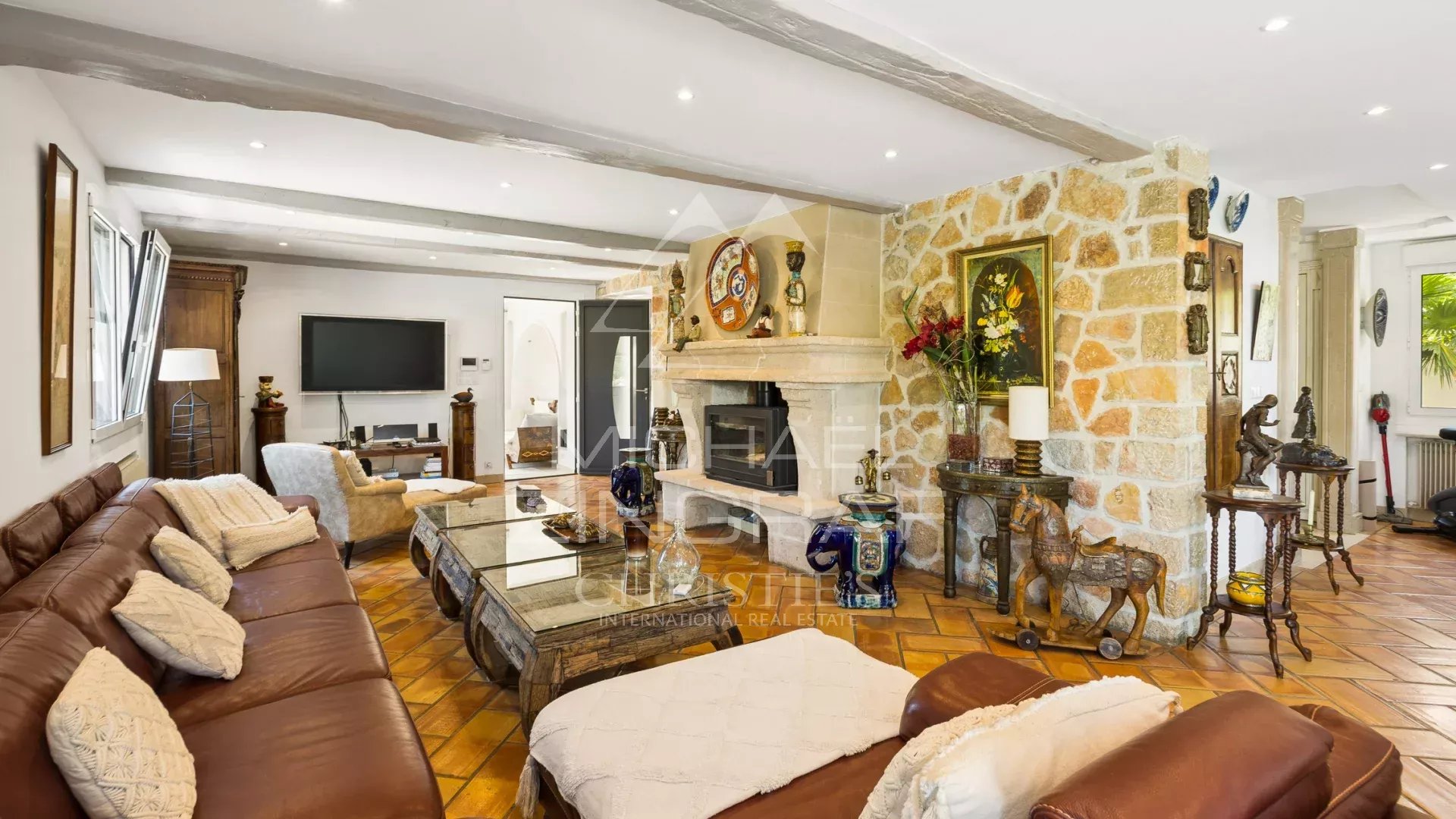 Living room of a property in Mandelieu-la-Napoule Spacious living room with fireplace and warm decor in a property in Mandelieu-la-Napoule.
