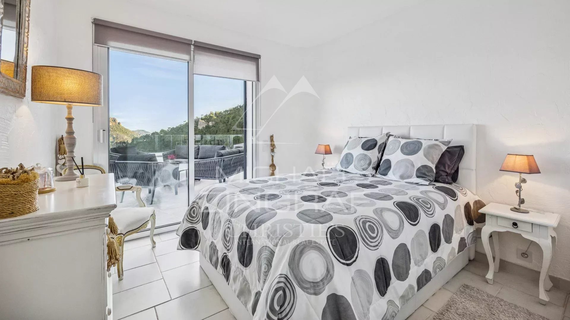 Room with a view in Mandelieu-la-Napoule Room with round patterned bed, mountain and sea view in Mandelieu-la-Napoule.