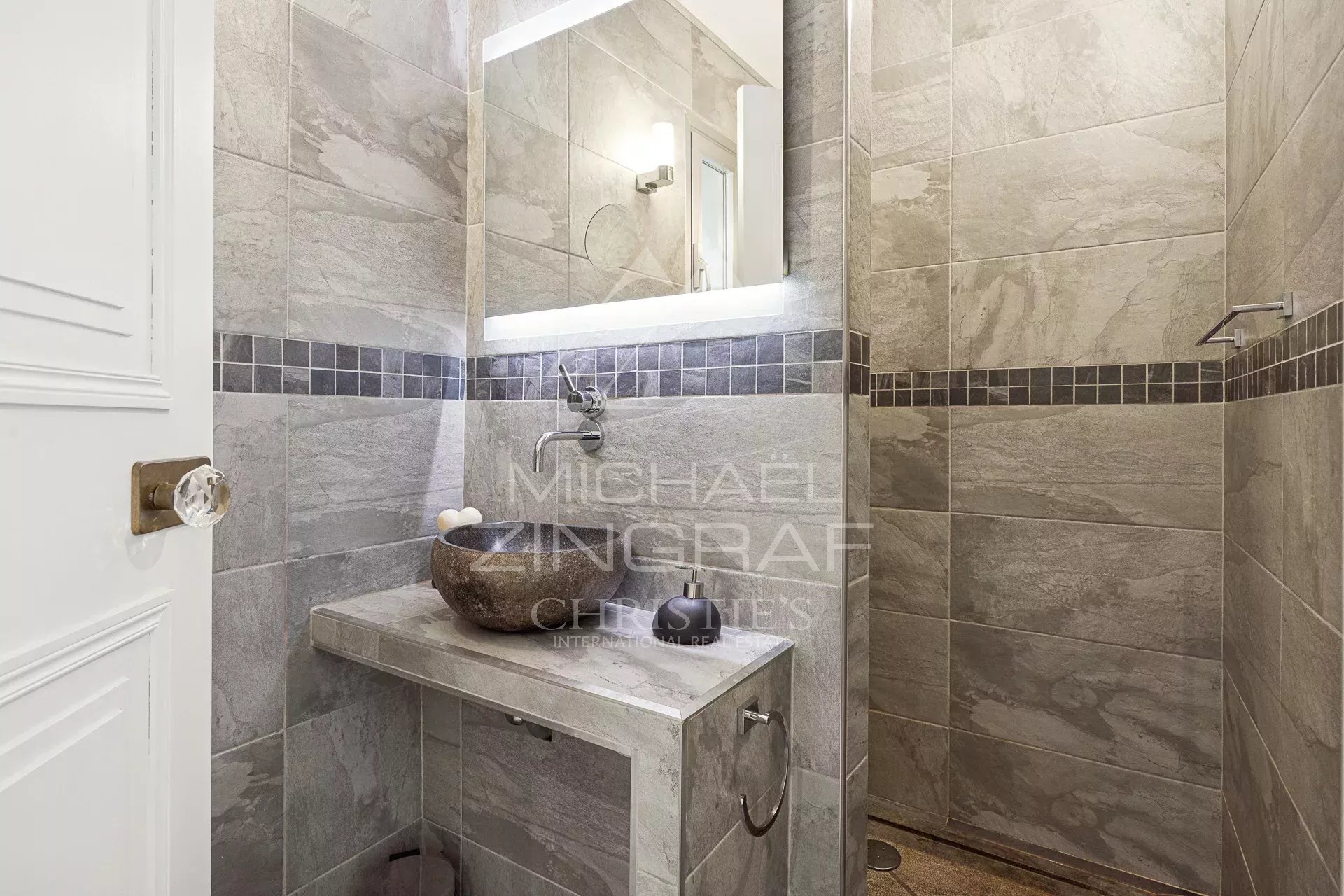 Elegant bathroom Modern bathroom with shower and stone sink.
