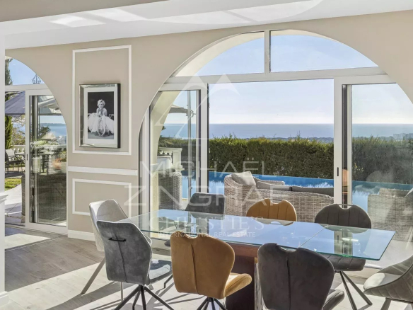 Interior of a villa in Mandelieu-la-Napoule with sea view, modern dining room.