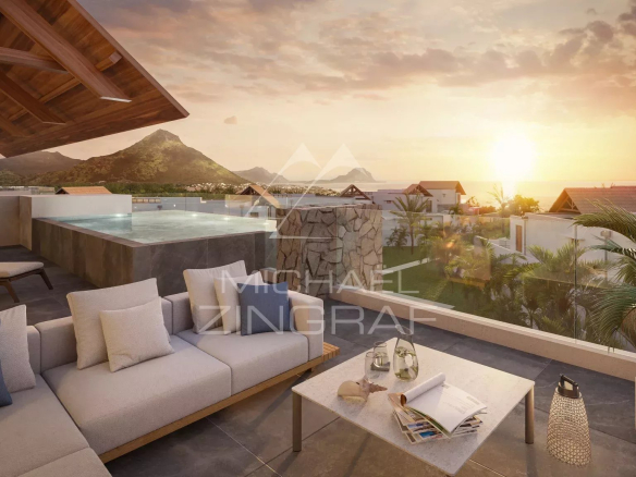 Luxurious outdoor terrace at sunset with a rectangular pool, beige seating, and a glass railing overlooking a tropical coastline and mountains.